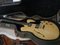 A Hudson Semi accoustic guitar with upraded Humbucker pickups and hard case