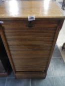 An oak 19C tambour front office filing cabinet