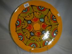 A large Poole pottery charger by Cynthia Bennett