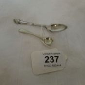 A silver mustard spoon and a silver teaspoon