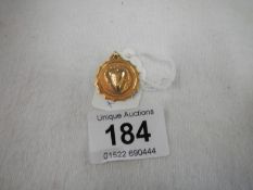 A 9ct gold watch fob 1922/23, engraved on back, 3gms