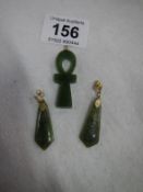 A pair of jade earrings and a jade Ankh