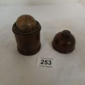 A miniature globe in wooden stand