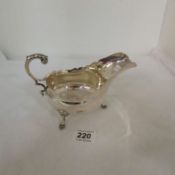 A silver gravy boat