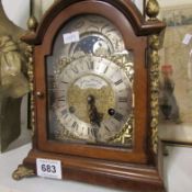 A Munrola brass inlaid bracket clock