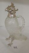 A 20th century 1 of only 4 made cut glass claret jug in the shape of a cockatoo with silver head and