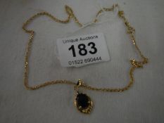 An 18ct gold chain and pendant set cornflower sapphires and diamonds