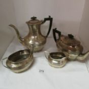 A 4 piece silver tea set approx. 1400g, a/f