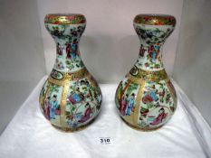 A pair of gourd shaped oriental vases