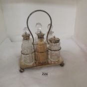 A 6 bottle cruet on plated stand