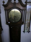 An oak long case 30 hour clock with brass round face by Hill Sheffield