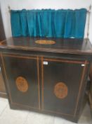 A 19th century inlaid mahogany cabinet with curtain rail pelmet