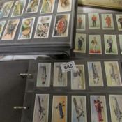 3 folders of cigarette cards including some sets (Player's, Gallagher, Wills, Ogdens etc)