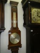 A Victorian oak mercury barometer by Negretti & Zambra, thermometer a/f