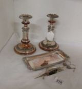 A pair of extending Sheffield plate candlesticks and candlesnuffer on tray