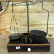 A set of Victorian brass balance scales with weights