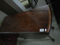 A pad foot mahogany drop leaf table