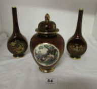 A pair of Carlton ware Rouge Royale vases and lidded jar