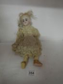 A Victorian porcelain doll