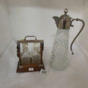 A glass claret jug with plated top and a miniature tantalus