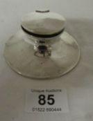 A silver inkwell, HM worn