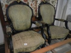 A pair of cabriole leg arm chairs