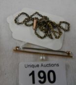 A 9ct gold bar brooch set pearl and a 9ct gold chain