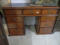 A Victorian mahogany kneehole desk with leather inset