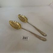 A pair of Georgian silver fruit spoons