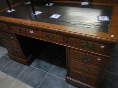 A Victorian mahogany kneehole desk with leather inset