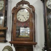 A Victorian inlaid wall clock, springs ok, all complete