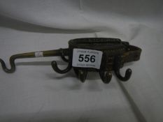 A rare leather WW1 brass tent pole coat hanger