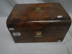 A domed top walnut box with key