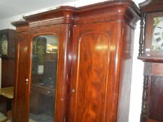 A Victorian mahogany break front wardrobe