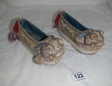 A pair of 19th century embroidered Chinese shoes