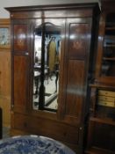 An Edwardian inlaid wardrobe