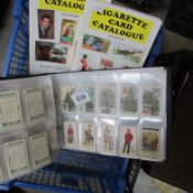 A collection of cigarette cards and 2 related price guides