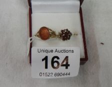 2 9ct gold rings, one set Cornelian and one set Garnets