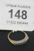 A 7 stone yellow gold diamond ring