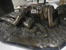A bronze reclining nude. Base loose