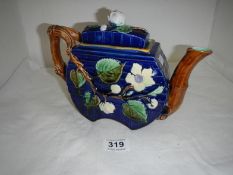 A Majolica teapot in the style of George Jones