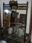 A large wall mirror with lacquered frame