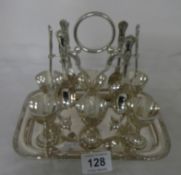 A Victorian silver plated egg cup stand with 6 egg cups