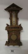 A 19th century pocket watch holder in the shape of a wall clock