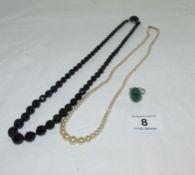 A row of pearls with silver clasp, a French jet necklace and a jade ring