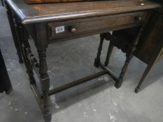 An early 19th century oak hall table