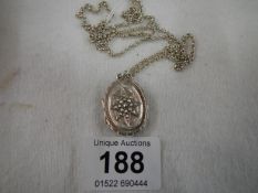 A silver locket and chain