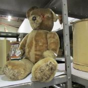 A vintage jointed teddy bear