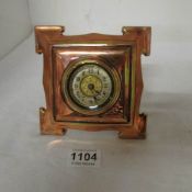 A late Victorian copper clock by 'The British United Clock Co.'