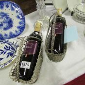 2 silver plated wine carriers with wine